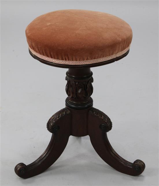 An Edwardian mahogany piano stool